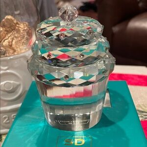 A Simon Designs cut crystal cupcake paperweight.